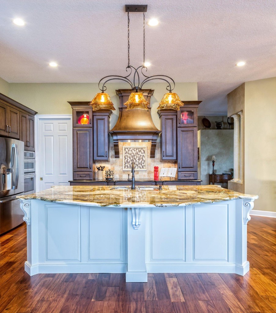 Remodeled kitchen with island and pendant lighting in central Kansas